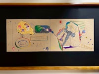 a black frame with a drawing on it
